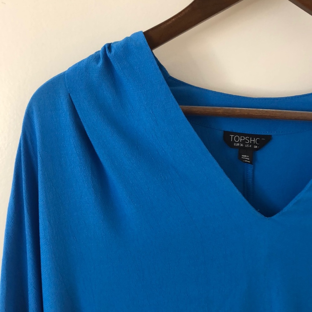 Bright blue blouse